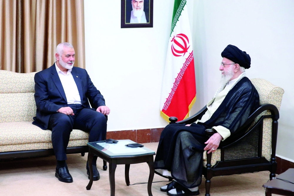Iran's Supreme Leader Ayatollah Ali Khamenei meets with Ismail Haniyeh in Tehran on Tuesday the day before he was killed. — AFP