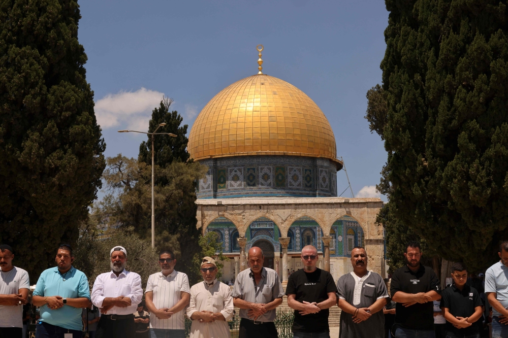 People perform the Friday prayer for slain Hamas leader Ismail Haniyeh in Al Aqsa mosque compound on. — AFP 