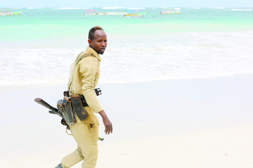 A Somali policeman patrols near the area of an attack in Mogadishu. - AFP
