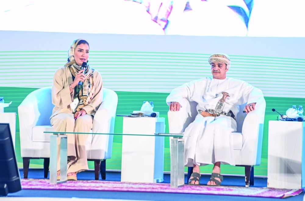 OCCI Board Member Dr Siham al Harthi speaking at the Omani-Arab Investment Forum on Sunday in the presence of Dr Ahmed bin Mohsen al Ghasani, Chairman of Dhofar Municipality. - ONA