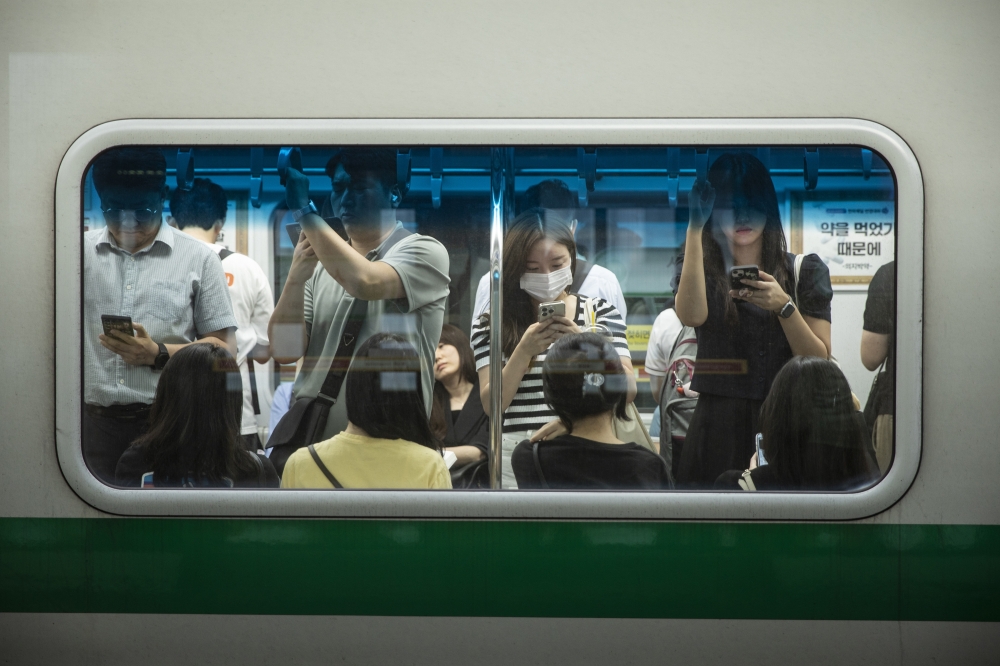 Commuters take a subway on their way home at Sungsu station in Seoul, South Korea on July 15, 2024.(Woohae Cho/The New York Times)