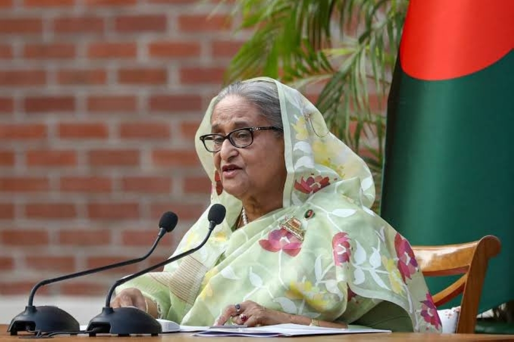 Bangladesh's Prime Minister Sheikh Hasina gestures while speaking to the media in January