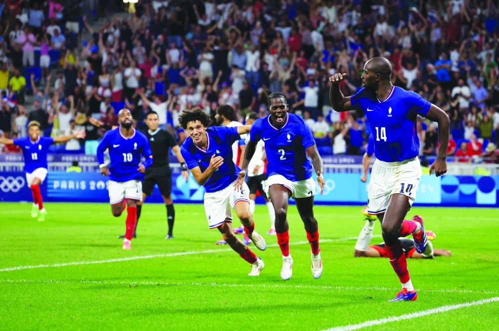 Jean-Philippe celebrates with teammates. — Reuters