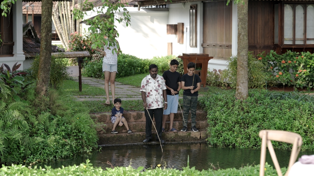 Children enjoy learning to catch fish at Kumarakom Lake Resort