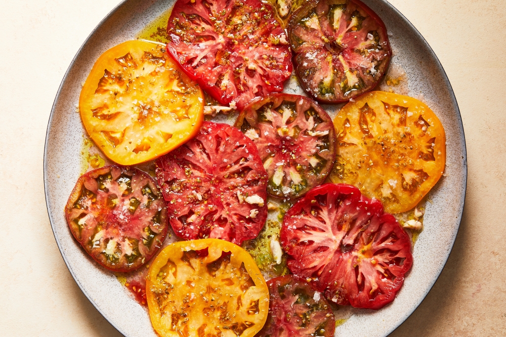 Tomatoes vinaigrette. Food styled by Cyd Raftus McDowell. (Armando Rafael/The New York Times)