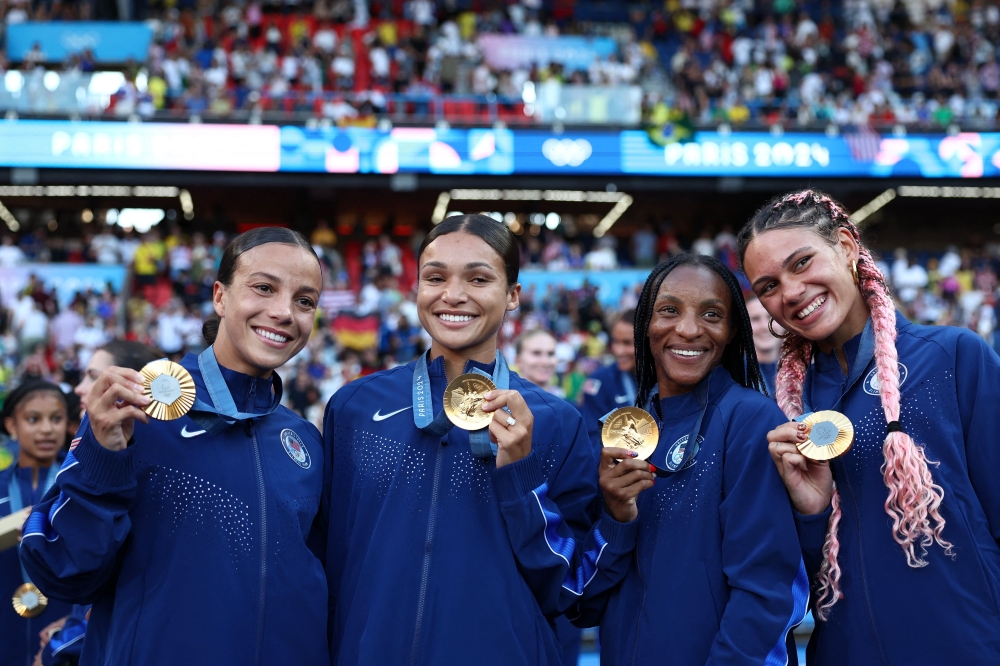 (From L) US' Mallory Swanson,  Sophia Smith, Crystal Dunn and Trinity Rodman. — AFP