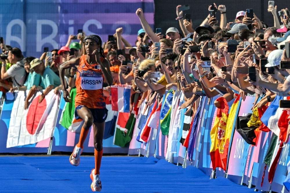 Netherlands' gold medallist Sifan Hassan sprints to cross the finish in first place. — AFP