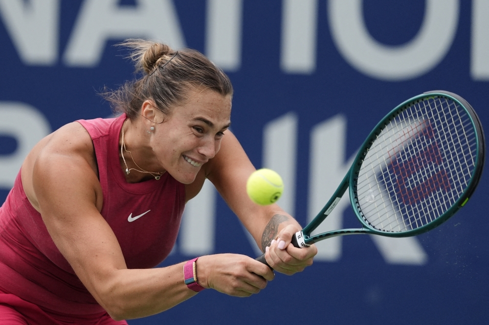 Aug 10, 2024; Toronto, Ontario, Canada; Aryna Sabalenka returns a ball to Amanda Anisimova (not pictured)  during quarter finals at Sobeys Stadium. Mandatory Credit: John E. Sokolowski-USA TODAY Sports
