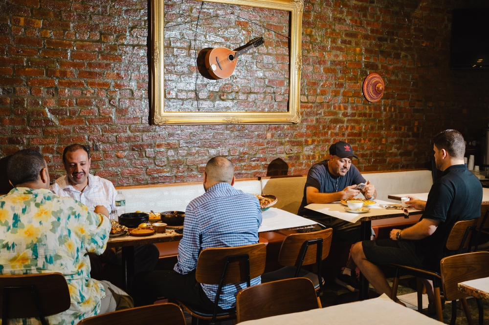 Patrons dine at Yemenat in Brooklyn, July 18, 2024. (Lanna Apisukh/The New York Times)