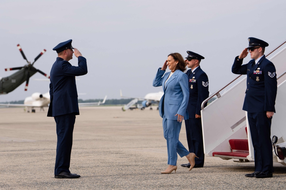US Vice President and Democratic presidential candidate Kamala Harris salutes as she steps off Air Force Two upon arrival at Joint Base Andrews in Maryland. - AFP

