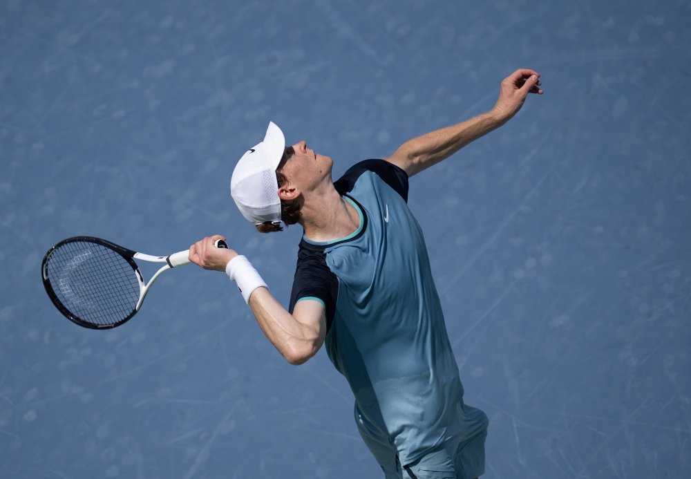 Jannik Sinner of Italy serves during his match against Andrey Rublev of Italy 