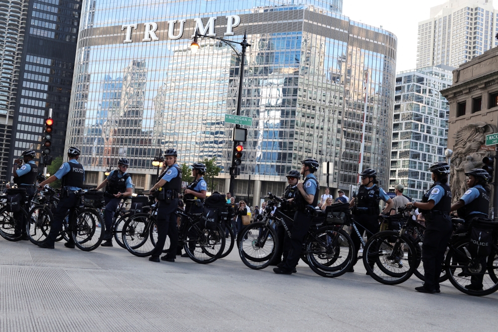 Police stand guard with cycles on the eve of the Democratic National Convention 