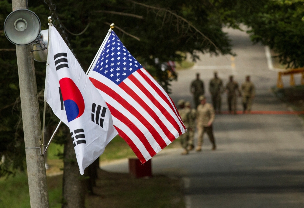 The South Korean and American flags fly next to each other at Yongin, South Korea 