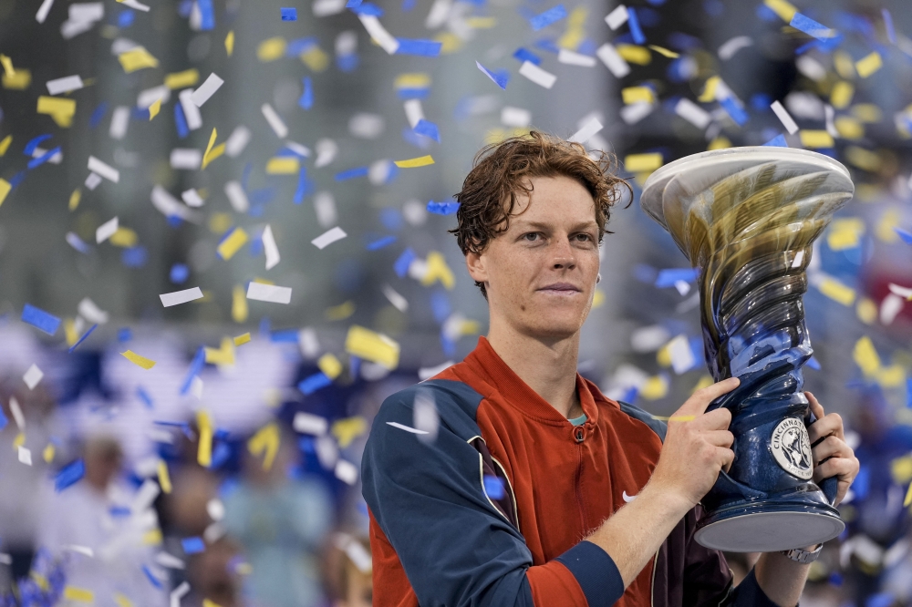 Aug 19 2024; Cincinnati, OH, USA; Jannik Sinner of Italy accepts the Rookwood Cup championship trophy after defeating Frances Tiafoe of the United States in the men’s singles final on day seven of the Cincinnati Open. Mandatory Credit: Sam Greene-The Cincinnati Enquirer/USA TODAY Sports
