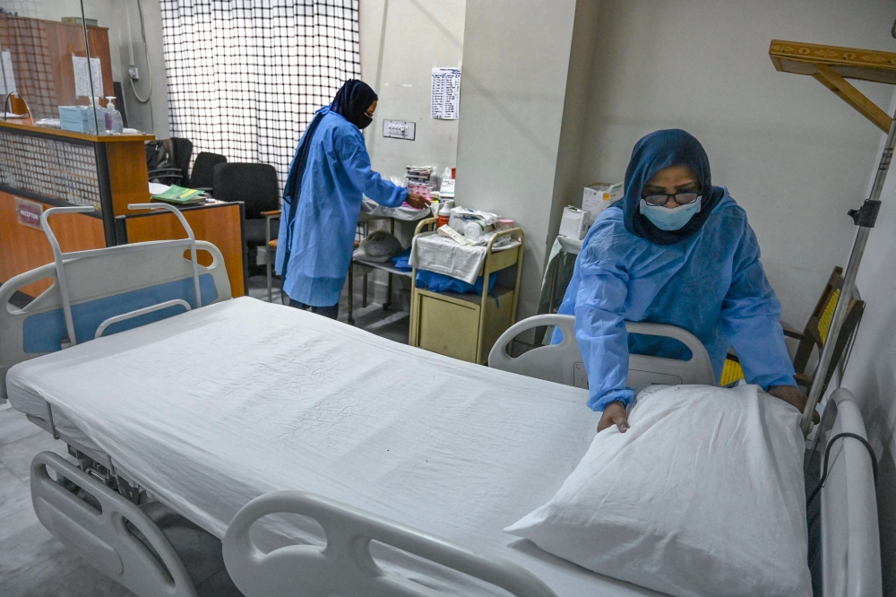 Health workers prepare an isolation ward for mpox patients