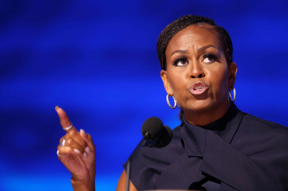 Former US First Lady Michelle Obama speaks at the United Center in Chicago, Illinois, on Tuesday. - AFP