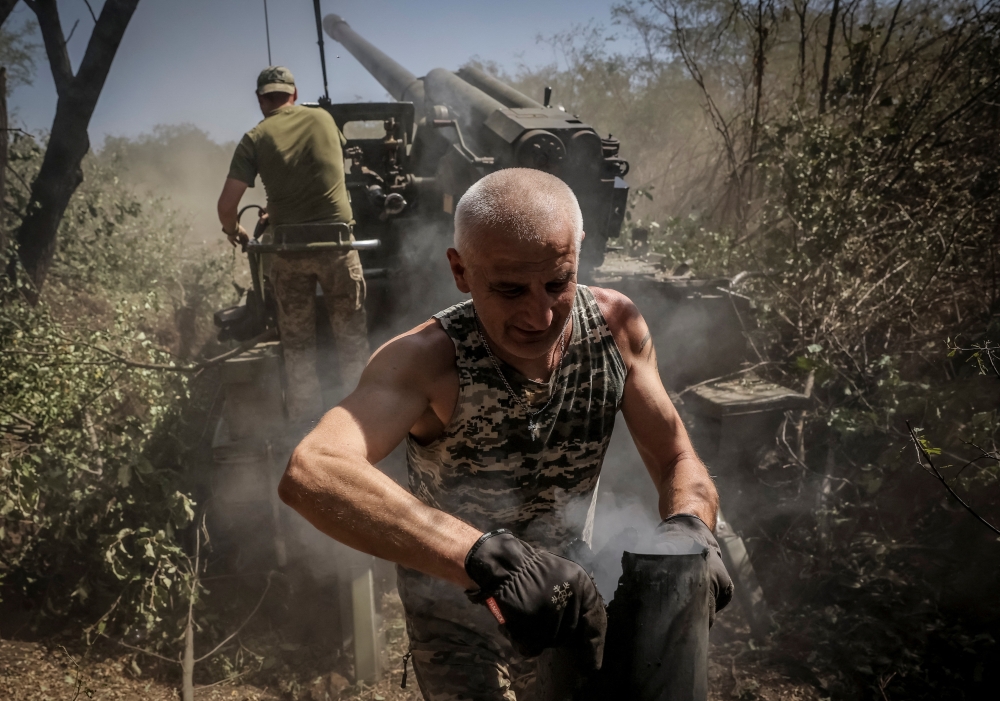 Servicemen of 24th Mechanized brigade of the Ukrainian Armed Forces fire a 2s5 "Hyacinth-S" self-propelled howitzer towards Russian troops at a front line, near the town of Chasiv Yar in Donetsk region, Ukraine. - Reuters
