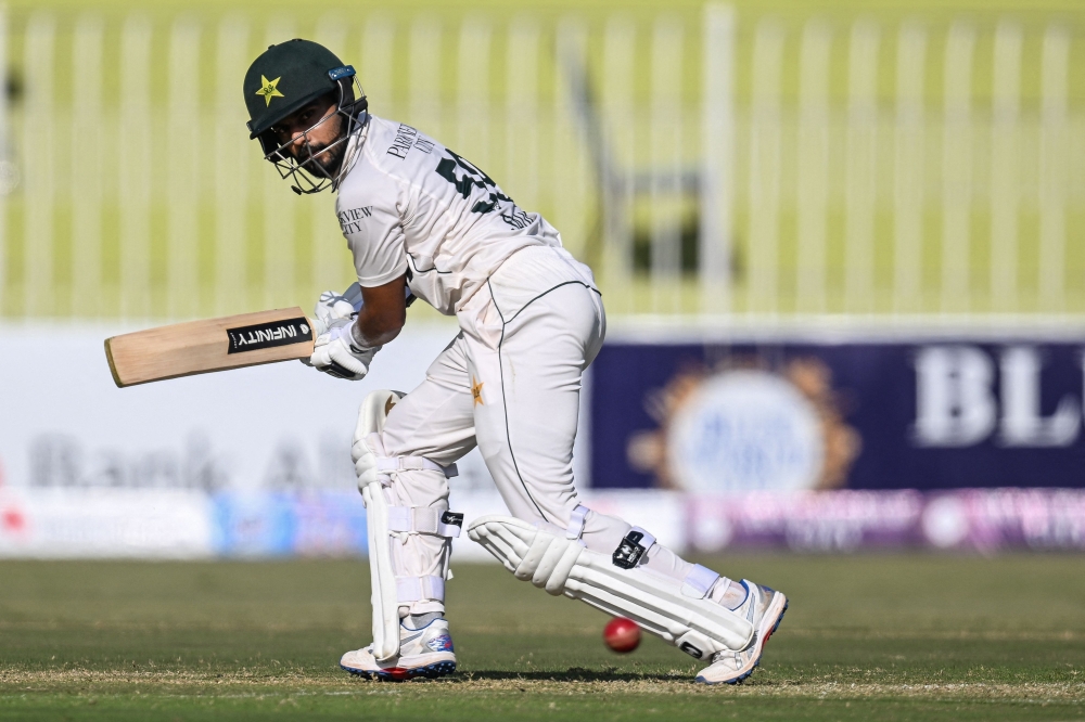 Pakistan's Saud Shakeel plays a shot during the first day of the first Test cricket match between Pakistan and Bangladesh at the Rawalpindi Cricket Stadium in Rawalpindi on August 21, 2024. (Photo by Farooq NAEEM / AFP)

