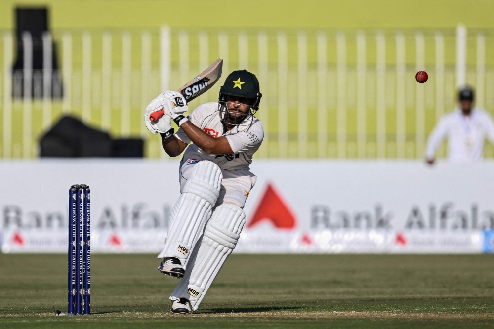 Pakistan Saim Ayub plays a shot during the first day of the first Test cricket match between Pakistan and Bangladesh at the Rawalpindi Cricket Stadium in Rawalpindi on August 21, 2024. (Photo by Farooq NAEEM / AFP)

