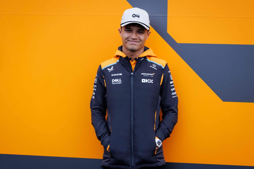 McLaren's British driver Lando Norris poses for a portrait on the paddock ahead of the Formula One Grand Prix race at The Circuit Zandvoort