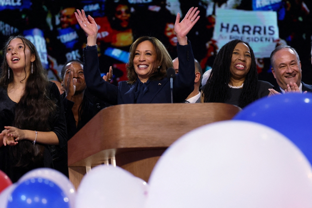 Democratic presidential nominee and Vice President Kamala Harris waves from the stage at the United Center in Chicago, Illinois, US. - Reuters