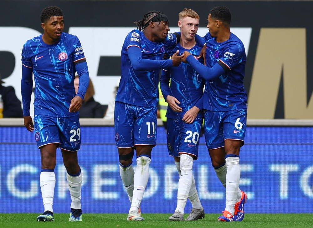 Chelsea's Noni Madueke celebrates scoring their fifth goal with Cole Palmer and Levi Colwill REUTERS 