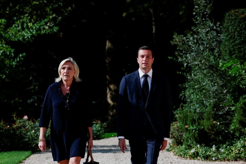 French far-right leader Marine Le Pen, member of parliament of the Rassemblement National (National Rally - RN) party and the party's President Jordan Bardella arrive at the Elysee Palace, in Paris. — Reuters 