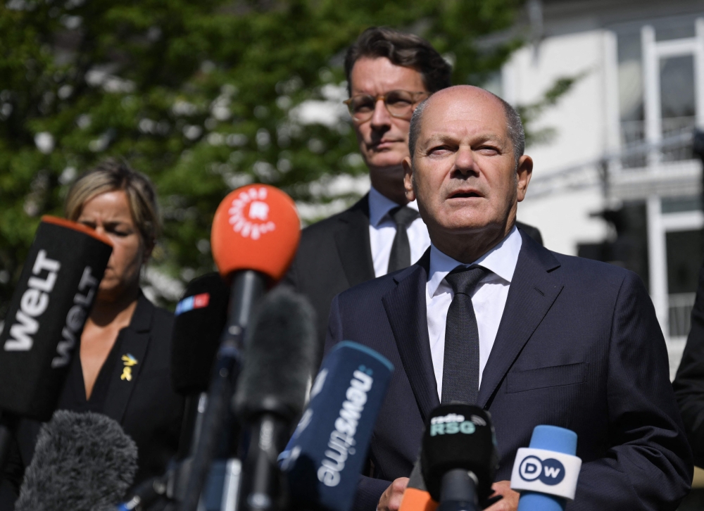 German Chancellor Olaf Scholz addresses media after his visit at the site of the attack in Solingen, western Germany. — AFP 