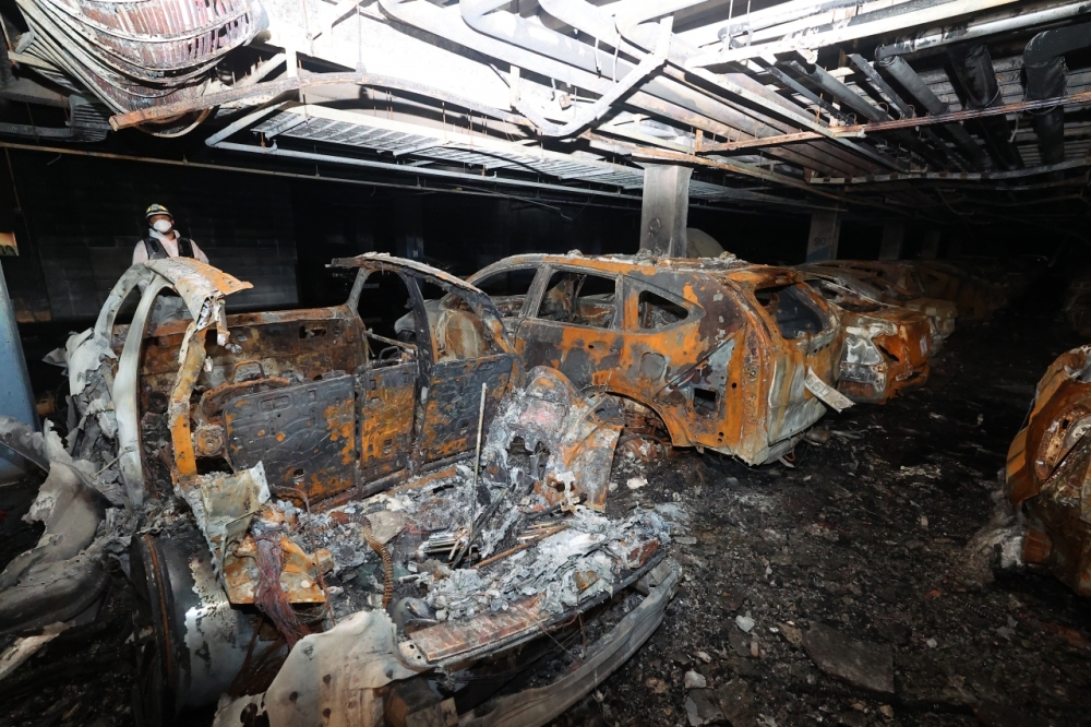 The fire damaged almost 900 cars, and 23 people suffered smoke inhalation.