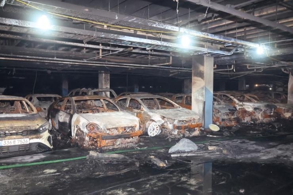 The fire damaged almost 900 cars, and 23 people suffered smoke inhalation.