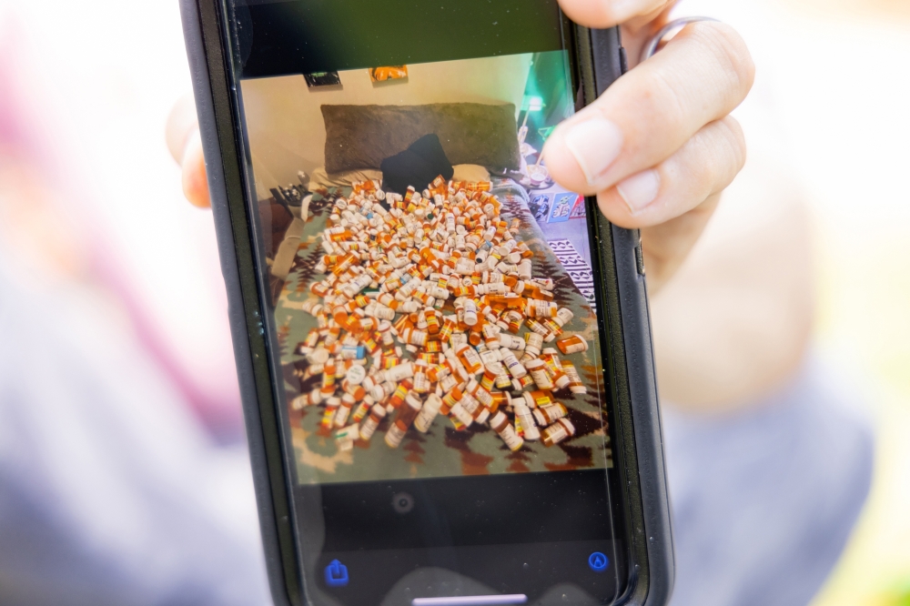 Shawn Connolly shows a photo of medications hes taken since 2015 for Parkinsons disease, in San Francisco on June 18, 2024. (Jason Henry/The New York Times)