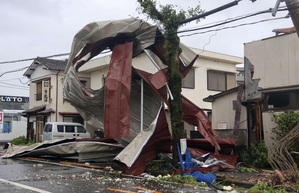 An object blown by strong winds caused by Typhoon Shanshan is stranded on a power line in Miyazaki, southwestern Japan, August 29, 2024, in this photo taken by Kyodo. Mandatory credit Kyodo/via REUTERS  ATTENTION EDITORS - THIS IMAGE HAS BEEN SUPPLIED BY A THIRD PARTY. MANDATORY CREDIT. JAPAN OUT. NO COMMERCIAL OR EDITORIAL SALES IN JAPAN.
