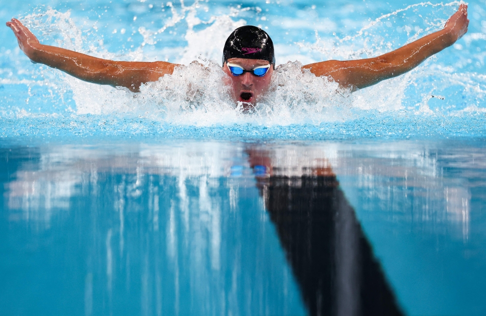 Gold medalist Neutral Paralympic Athletes' Ihar Boki competes in the men's S13 100m butterfly swimming event during the Paris 2024 Paralympic Games  