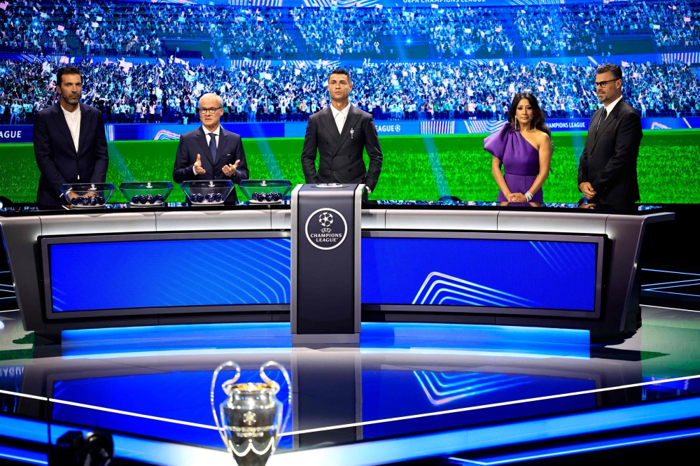 Italy's former goalkeeper Gianluigi Buffon, UEFA Deputy General Secretary Giorgio Marchetti, Portugal's national team player and Saudi Al-Nassr's forward Cristiano Ronaldo