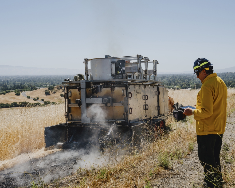A Burnbot scorches the ground to create a firebreak to keep wildfires from growing, on grasslands at Stanford University in Palo Alto, California.