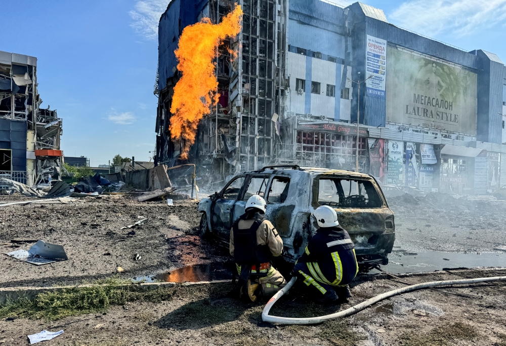 Firefighters work at a site of a Russian missile strike, in Kharkiv, Ukraine. — Reuters 
