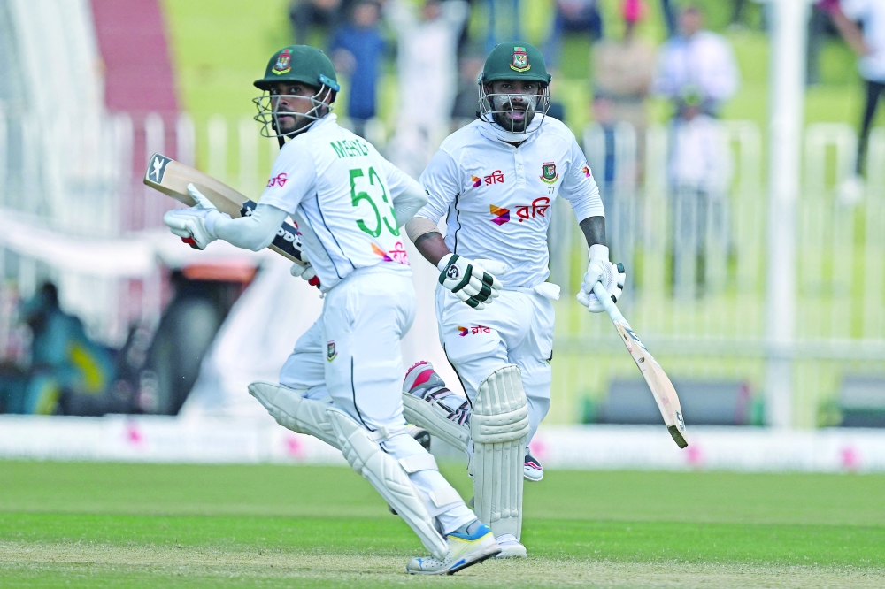 Bangladesh's Liton Das (R) and Mehidy Hasan Miraz run between the wickets. —  AFP

