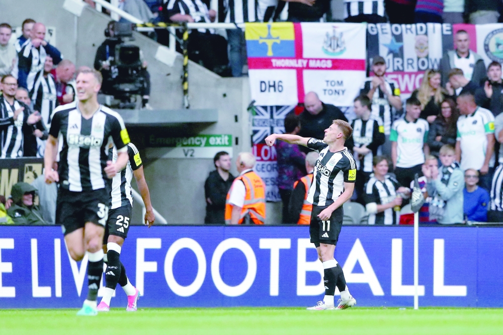 Newcastle United's Harvey Barnes celebrates scoring their first goal.