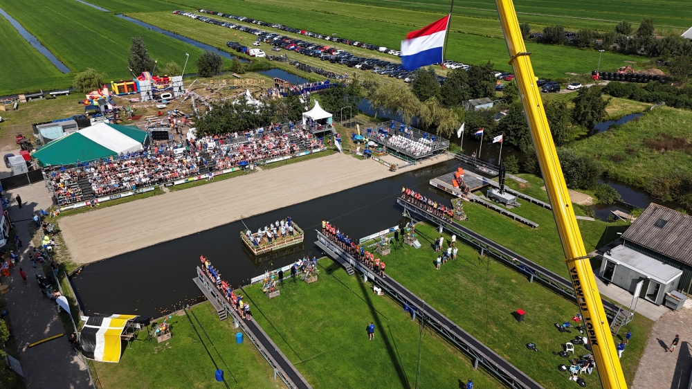 A drone view shows the ceremony on the day of a yearly national 'fierljeppen' or canal vaulting contest in the village of Polsbroekerdam, Netherlands August 31, 2024. REUTERS/Bart Biesemans
