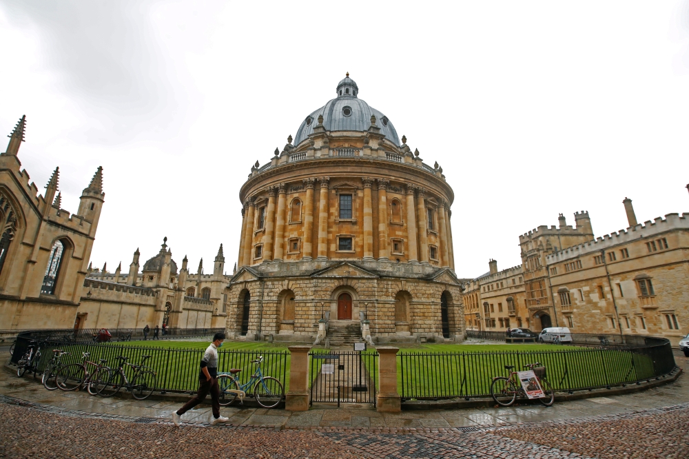A man walks in front of the buildings of Oxford University. Image for illustration only. — Reuters