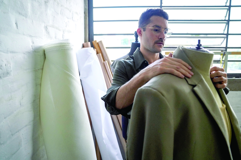 Mexican designer Patricio Campillo, who will debut at New York Fashion Week, dresses a mannequin in his studio in Mexico City, Mexico.