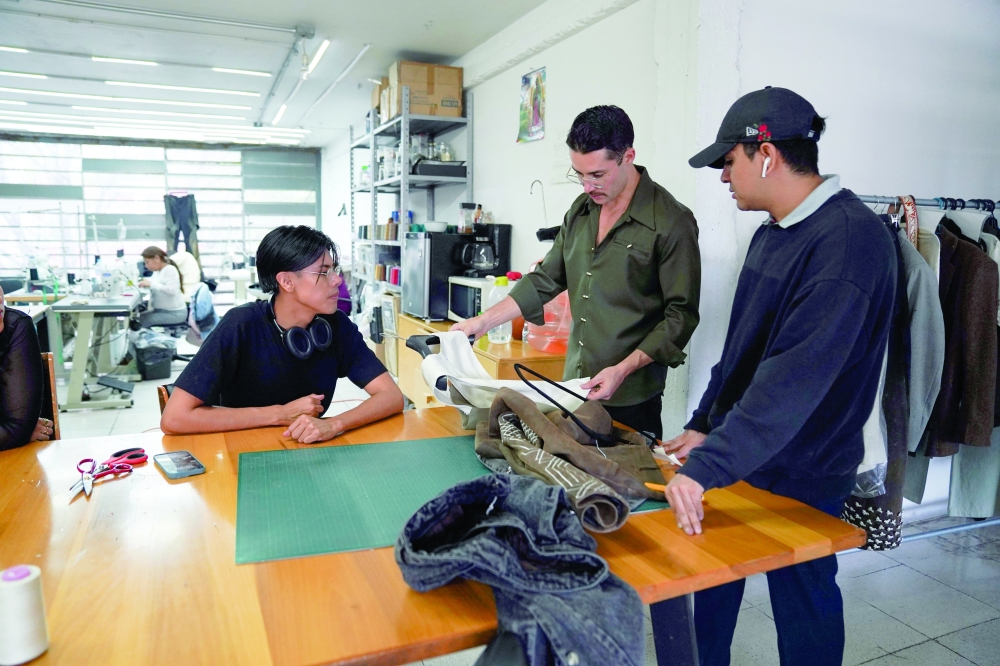 Mexican designer Patricio Campillo, who will debut at New York Fashion Week, speaks to his team in his studio in Mexico City, Mexico.