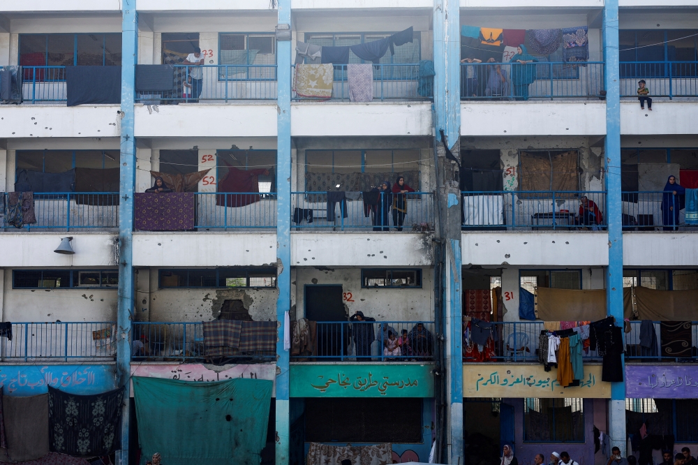 Displaced Palestinians shelter in a school, in Khan Yunis in the southern Gaza Strip 