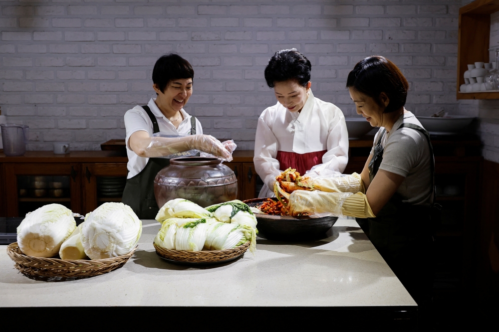 Lee Ha-yeon, a recognised kimchi grand master and her apprentices prepare kimchi at the Kimchi Culture Institute in Namyangju