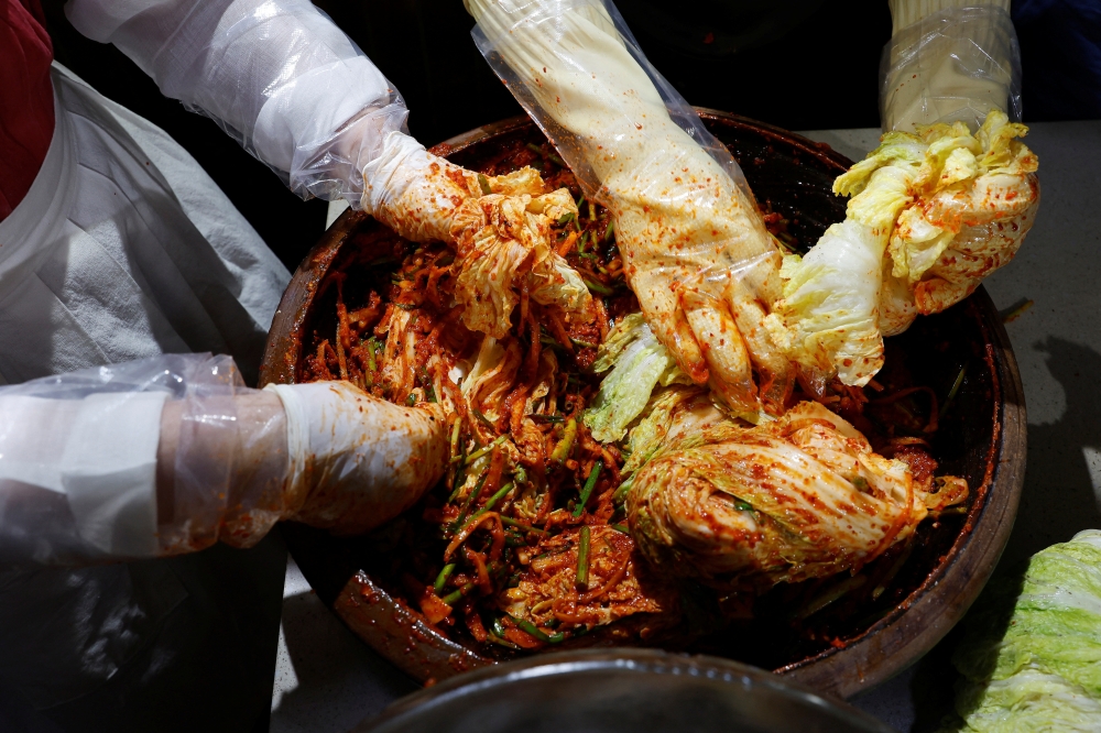Lee Ha-yeon, a recognised kimchi grand master and her apprentices prepare kimchi at the Kimchi Culture Institute in Namyangju 