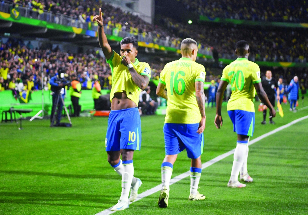 Brazil's forward Rodrygo (L) celebrates after scoring. — AFP