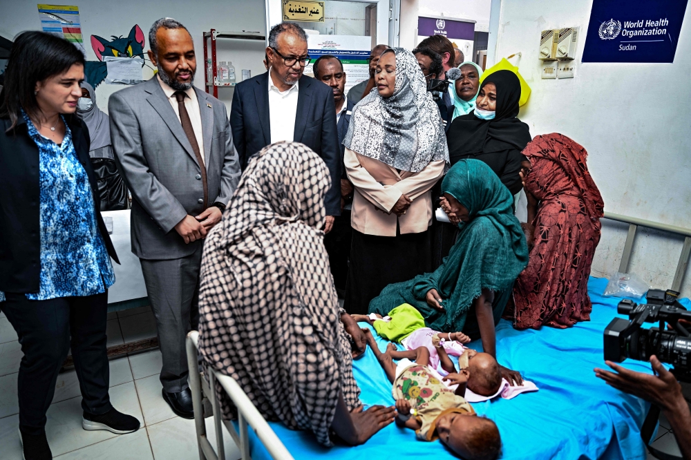 Director-General of the World Health Organization (WHO) Tedros Adhanom Ghebreyesus (C) visits a children's hospital in Port Sudan. — AFP 