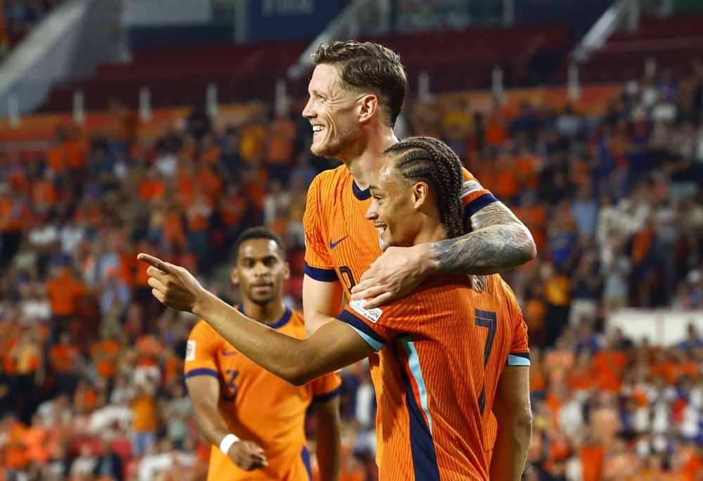 Netherlands' Xavi Simons celebrates scoring their fifth goal with Wout Weghorst. — Reuters
