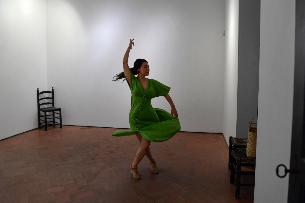 Japan's Junko Hagiwara, also known as La Yunko, poses for pictures at the Instituto Andaluz de Flamenco in Seville, on August 29, 2024. Japan's Junko Hagiwara has caused a stir in Spain's traditional flamenco world by unexpectedly winning the prize for best dancer at the country's leading flamenco festival -- the first foreigner to do so. The announcement that "La Yunko" was awarded the honour at the closing ceremony of the "Cante de las Minas" festival in the southeastern town of La Union on August 10 was met with a mixture of applause and some jeering. (Photo by CRISTINA QUICLER / AFP)
