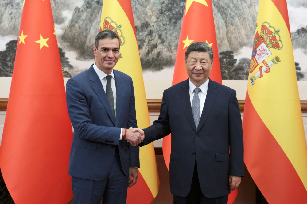 Chinese President Xi Jinping and Spanish Prime Minister Pedro Sanchez shake hands at their meeting in Beijing, China. — Reuters 